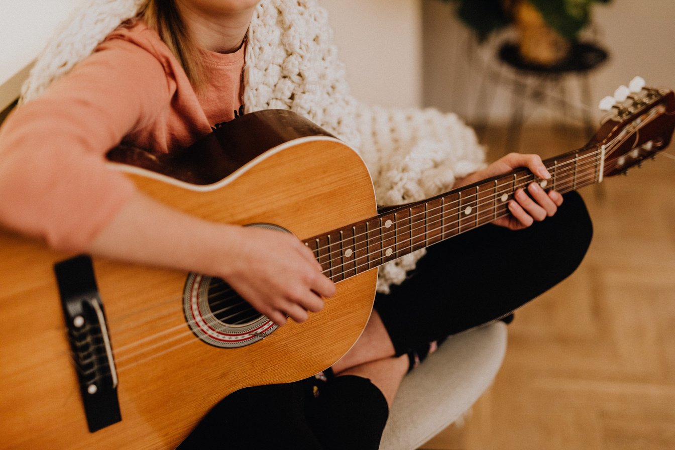 Woman Playing Guitar